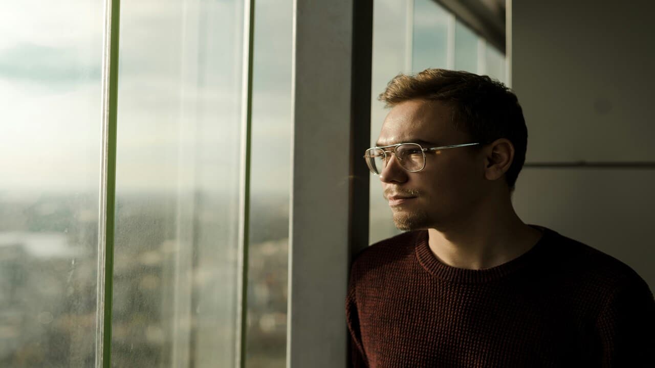 A man looking out the window