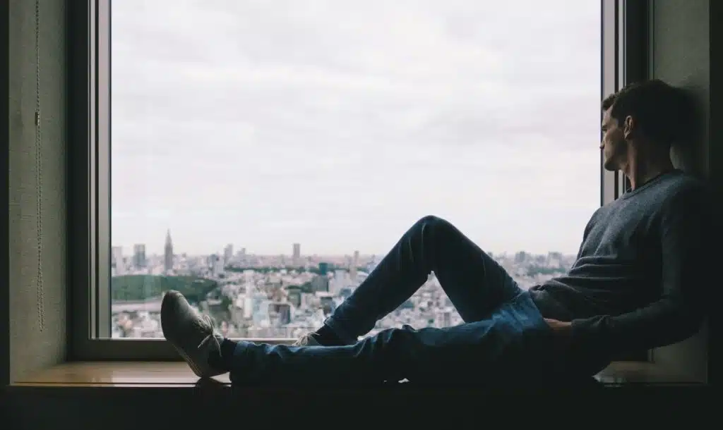 A man looking out the window