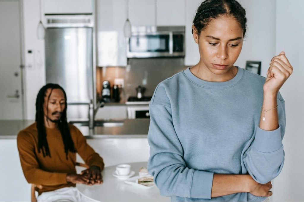 A woman turning her back to a man