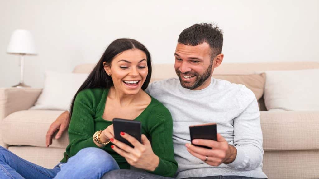 A woman teaching her friend how to text
