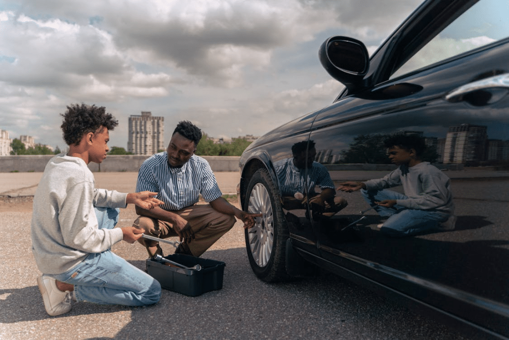 Father and sun fixing the car