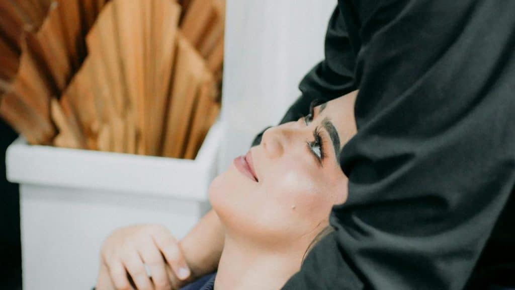 A woman looking up affectionately at someone close to her.