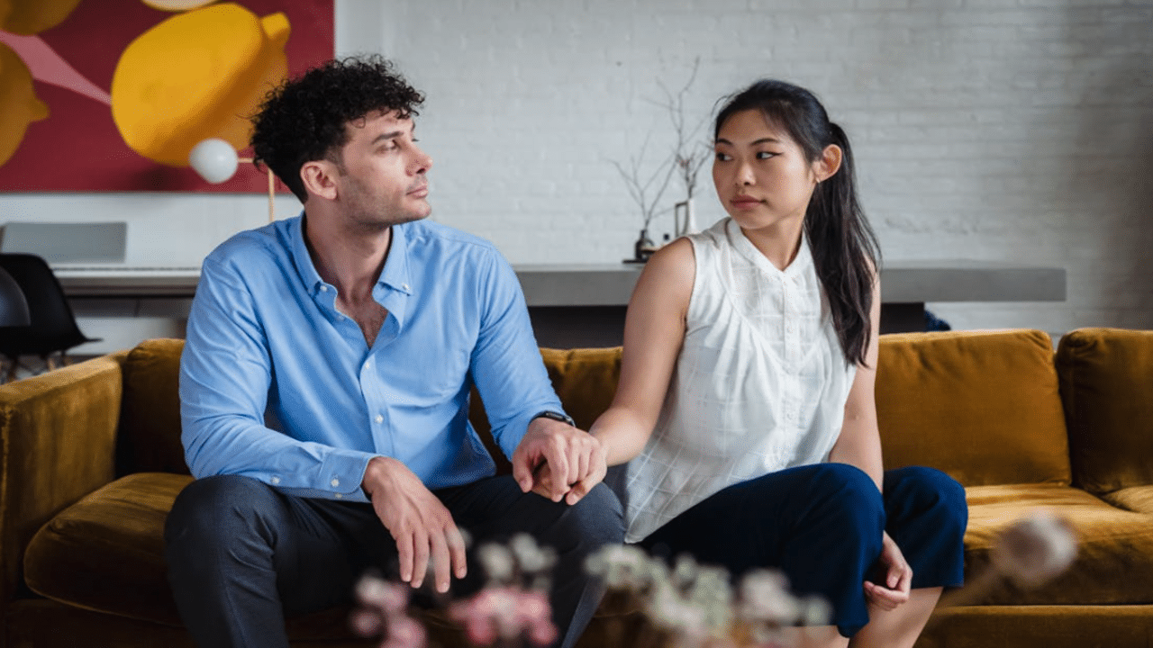 A couple looking at each other during therapy