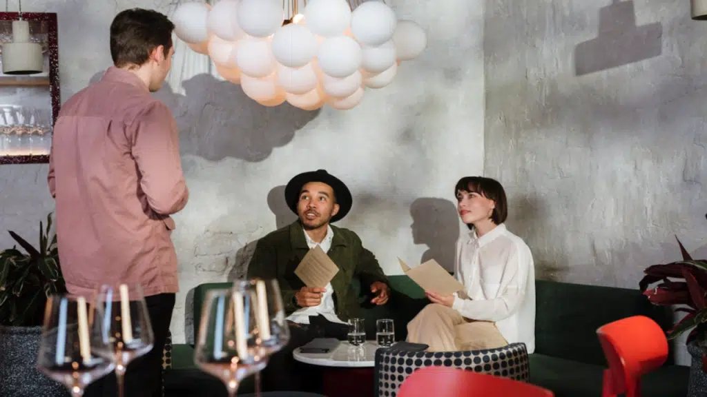 A couple talking to a waiter