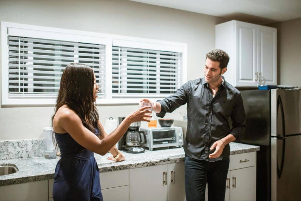 A man and woman at the kitchen