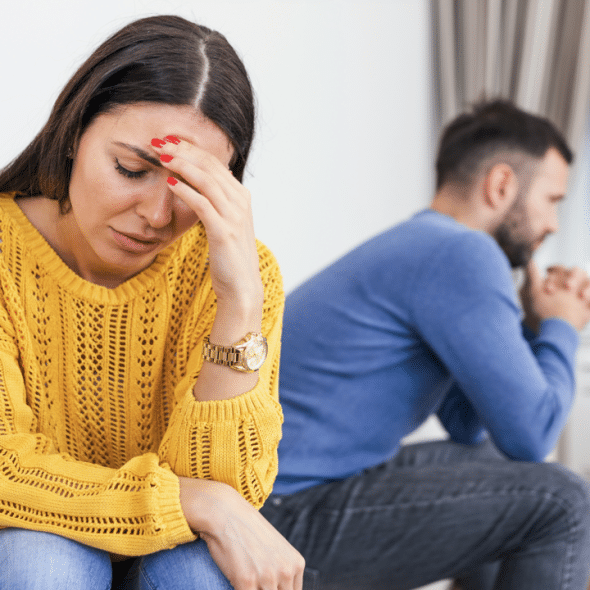 A woman looking upset at her husband