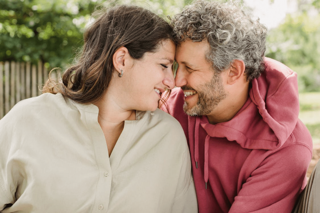 A sweet couple smiling at each other