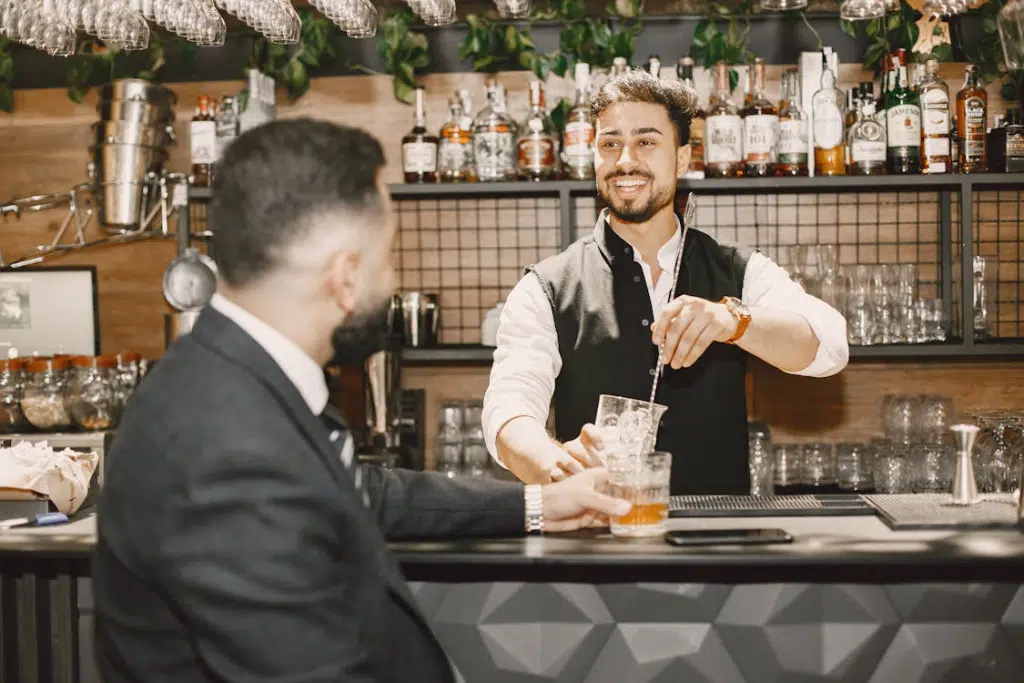 A man and a barista talking