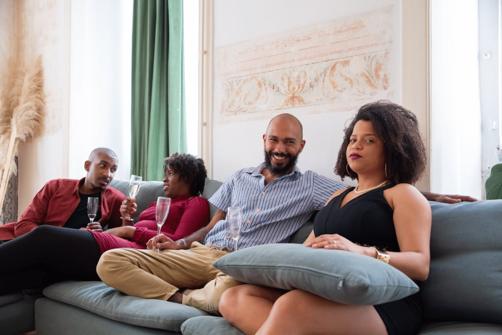 Men and women sitting on a sofa