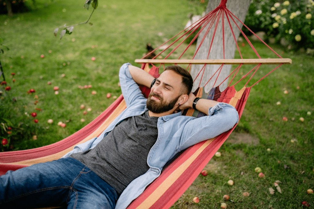 A man lying on a hammock