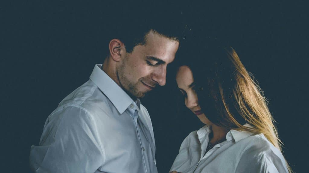 A man and a woman standing next to each other.