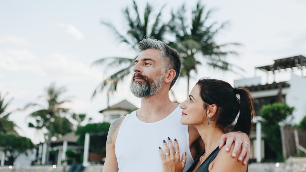 A couple walking down a street.