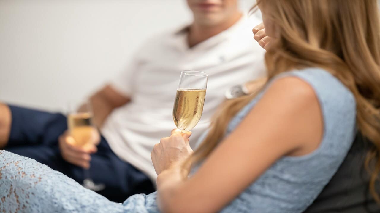 A couple having champagne together