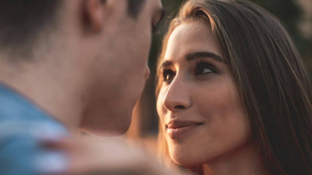 A young girl is looking at a man with true love and care.