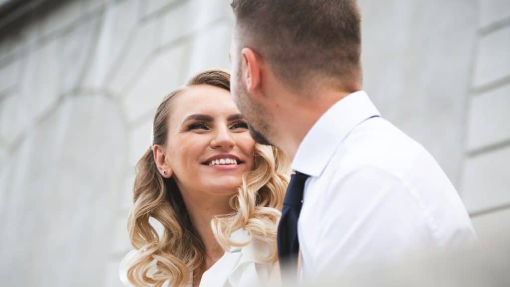 A woman smiling at a man.