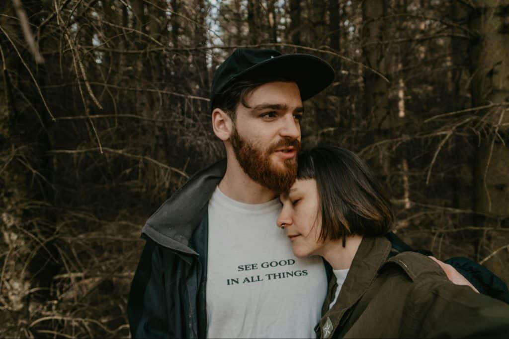 A man letting a woman to rest on his chest