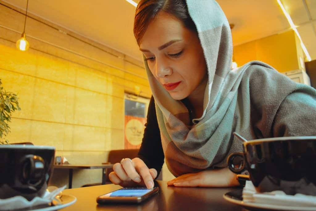 A woman looking at her phone.