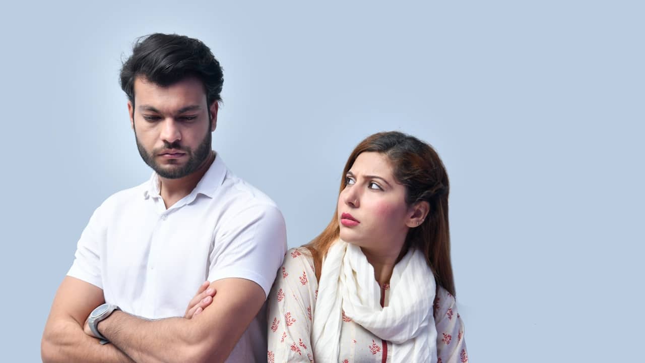 A man and a woman standing next to each other.
