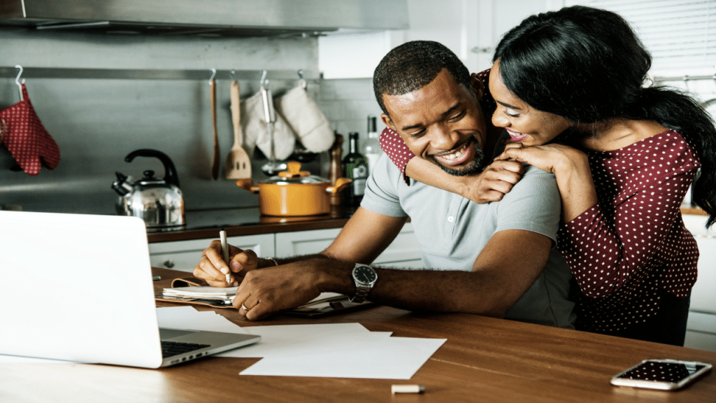 A couple making plans in the kitchen