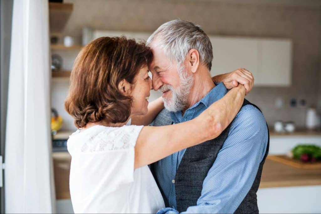 A man and woman hugging each other