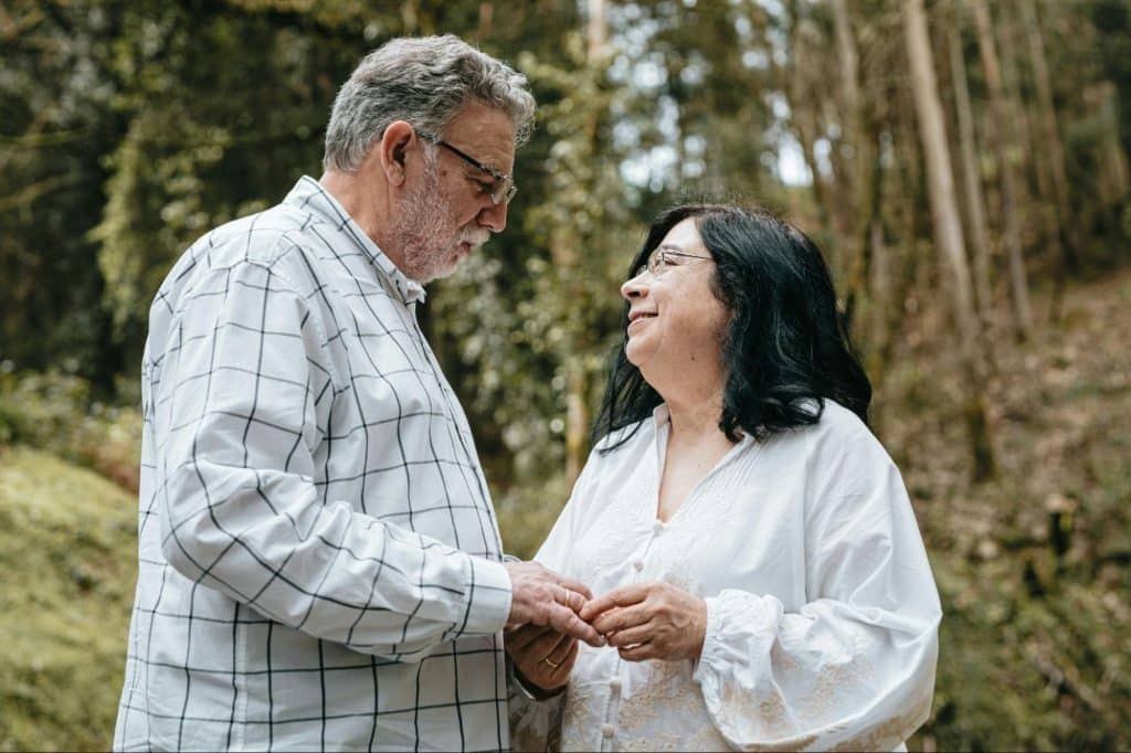 A man and woman holding hands
