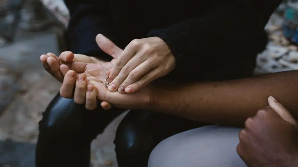 A woman returning her engagement ring to her boyfriend
