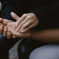 A woman returning her engagement ring to her boyfriend