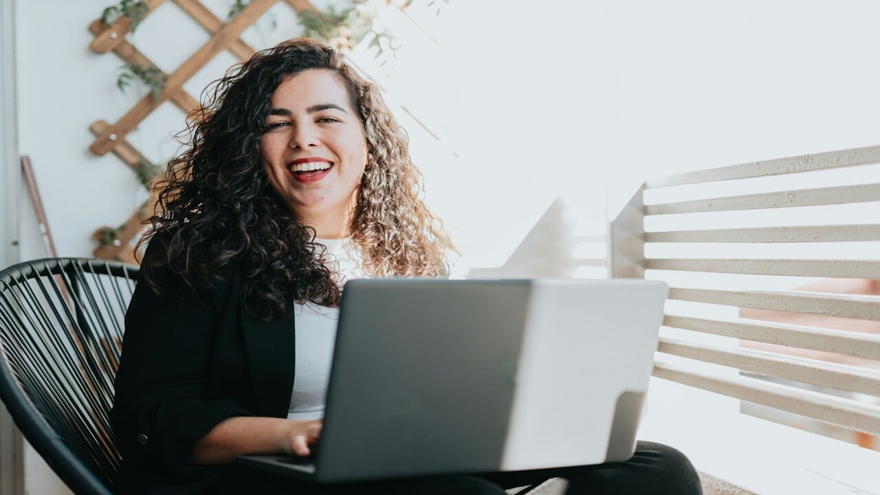 A woman smiling while working