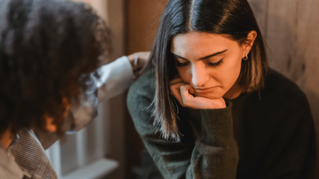 A sad woman being comforted