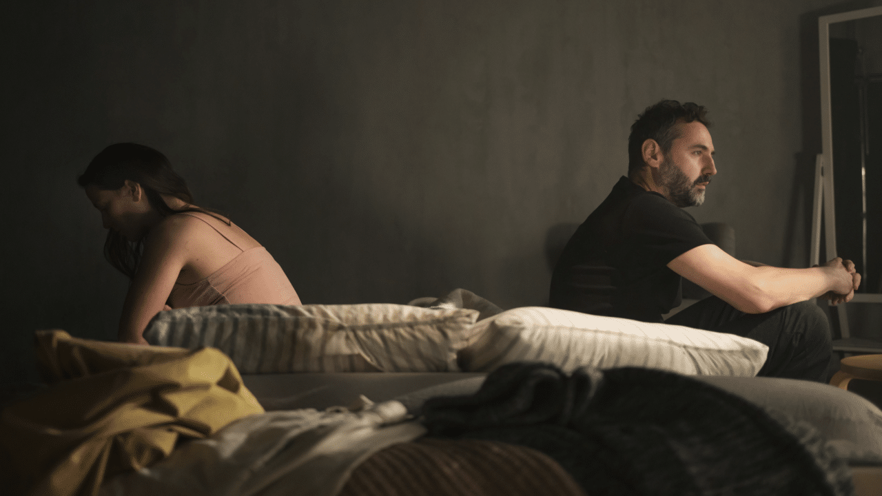 A couple looking depressed at home 