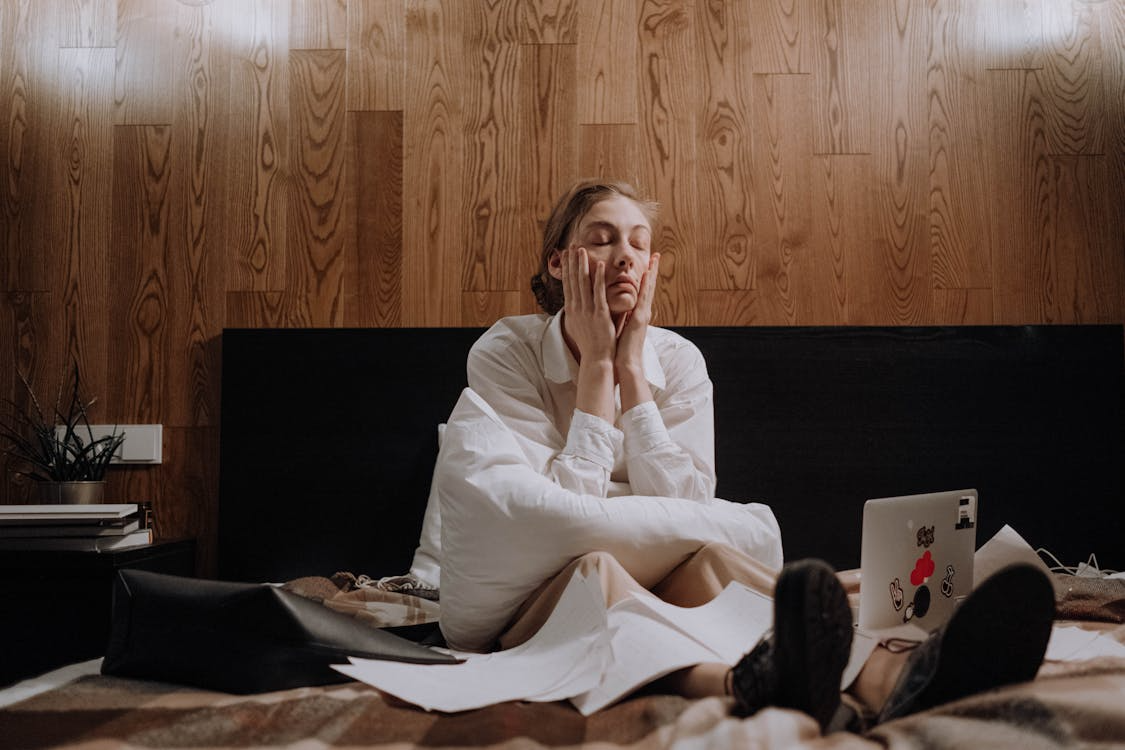 A woman sitting on the bed