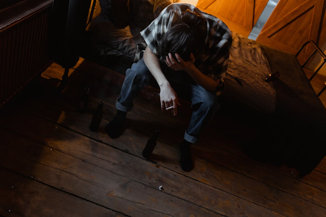 Distressed man smoking cigarette