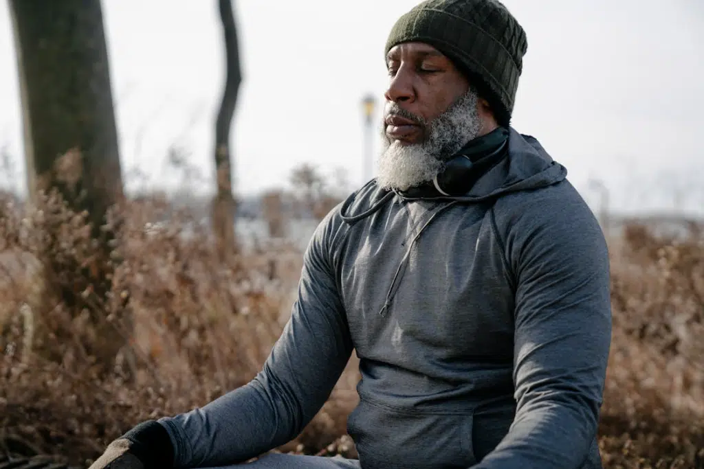 A meditating man in a park