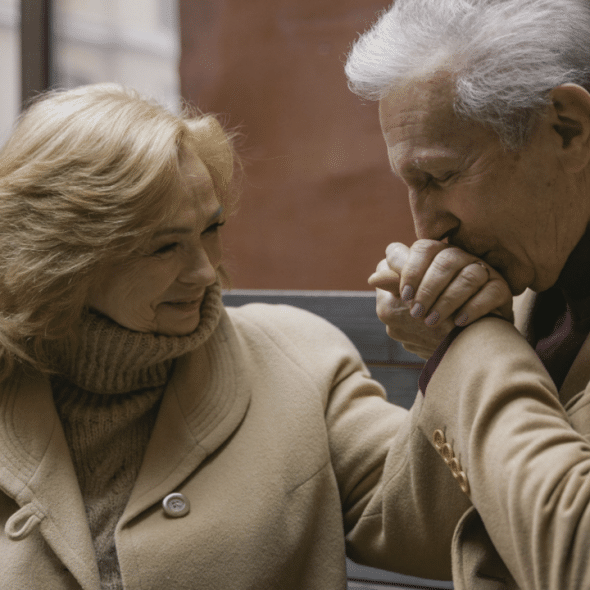 A husband kissing his wife’s hand