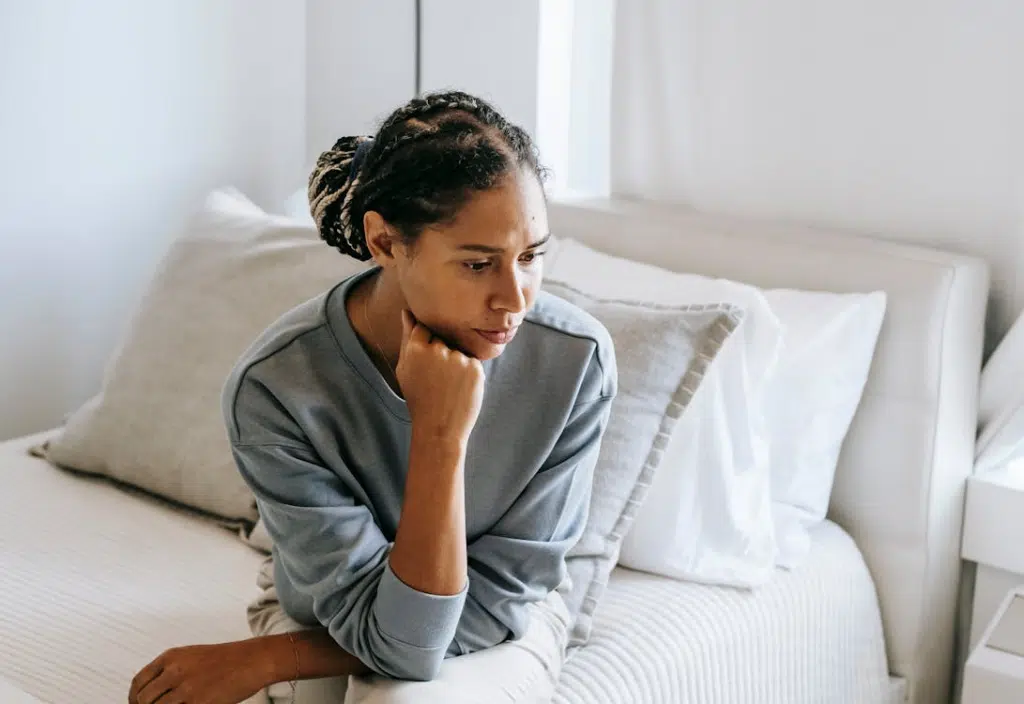 A woman sitting on the bed