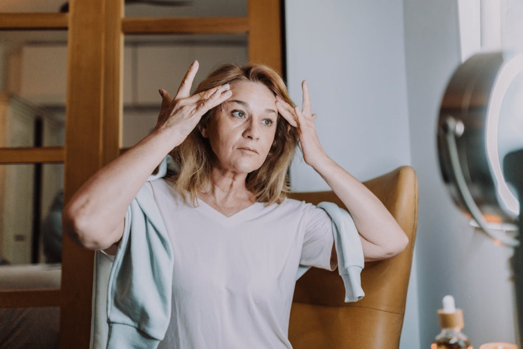 A woman massaging her face