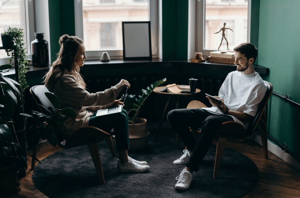 A man and a woman sitting across each other
