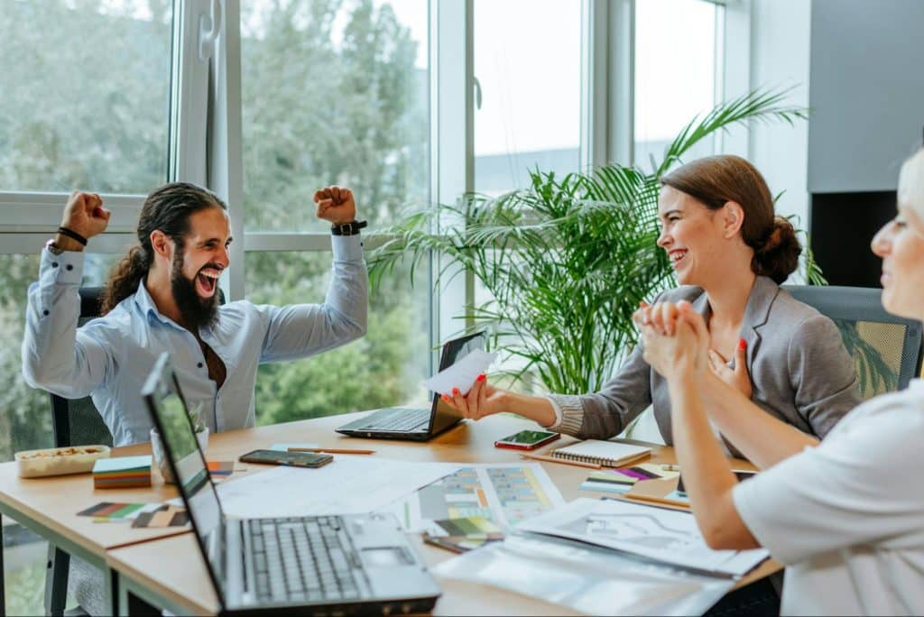 A man and woman with their colleague
