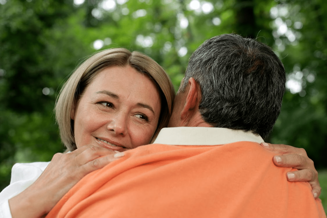 A man and a woman hugging each other