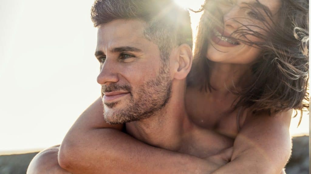 A couple in love having fun on the beach.
