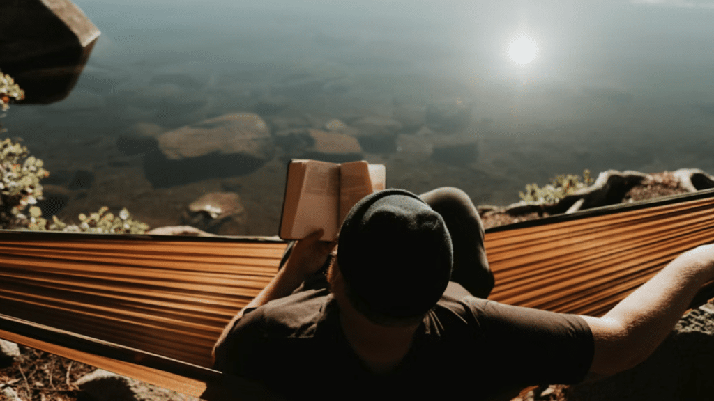 A man relaxing on a hammock