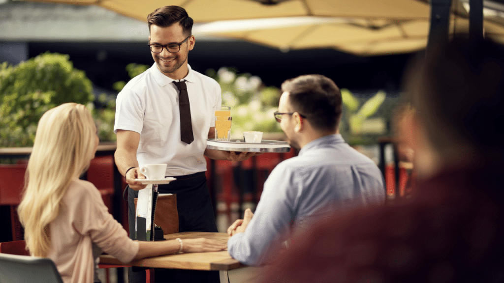A couple talking to a waiter