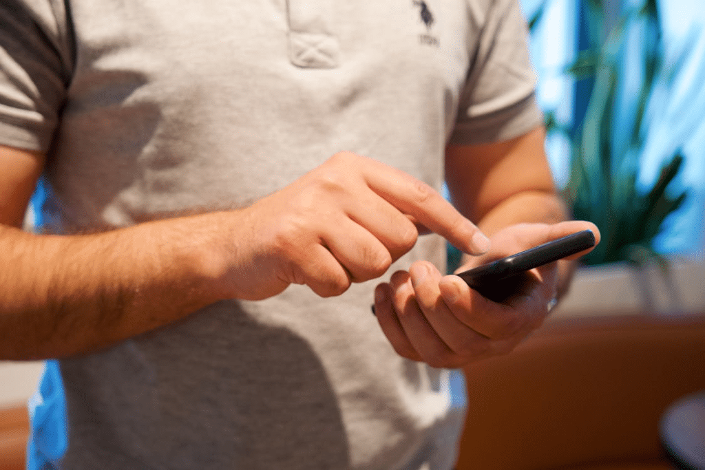 Man Tapping on Smartphone