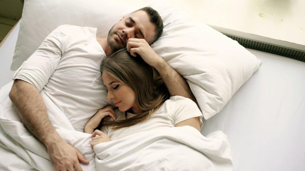 A couple sleeping peacefully together