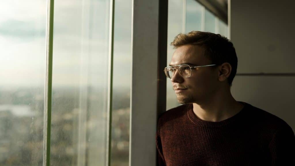 A man looking out the window