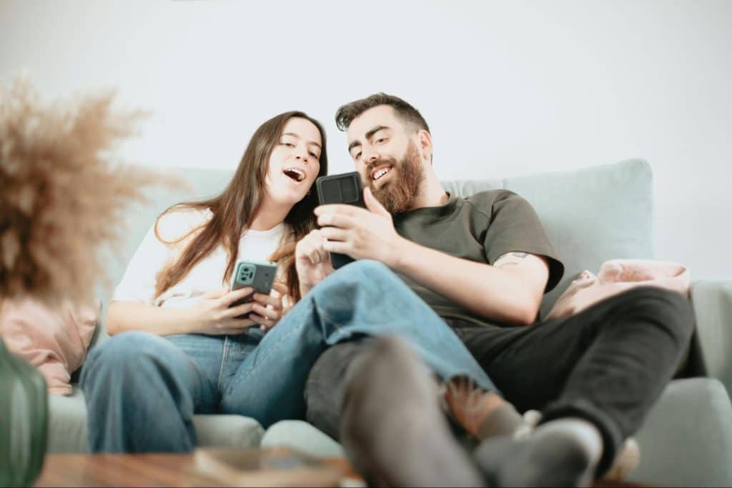 A man showing something to woman
