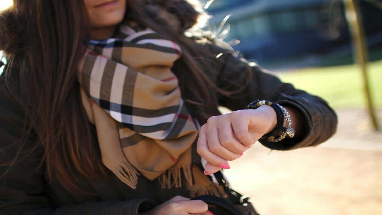 A woman checking the time