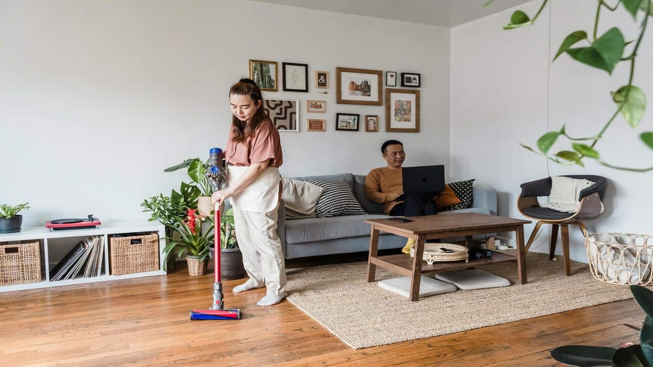 A couple doing their own thing at home