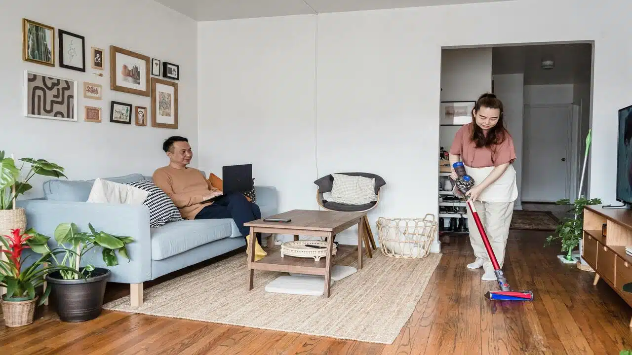A couple doing their own thing in the living room