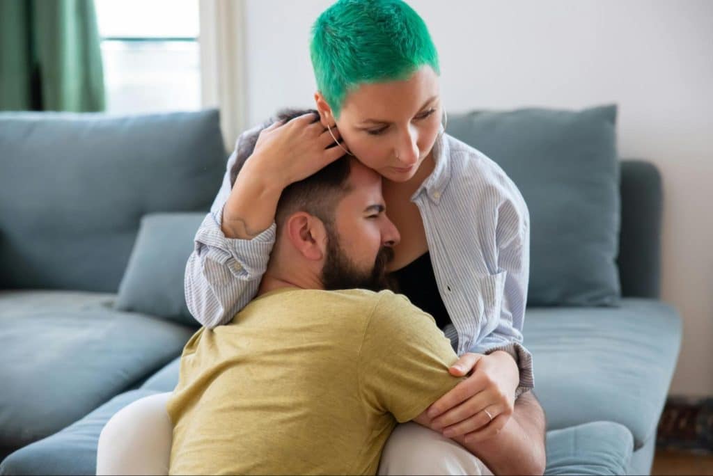 A man hugging a woman